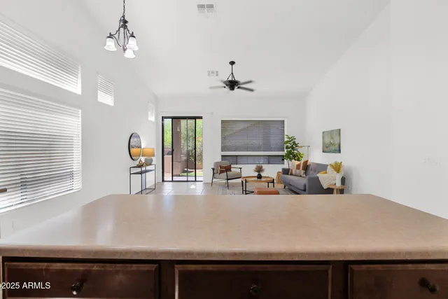 a view of a living room and chandelier
