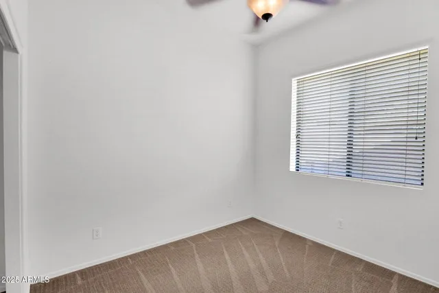 a bathroom with a toilet sink and shower