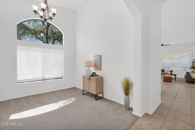 a view of livingroom with furniture and chandelier