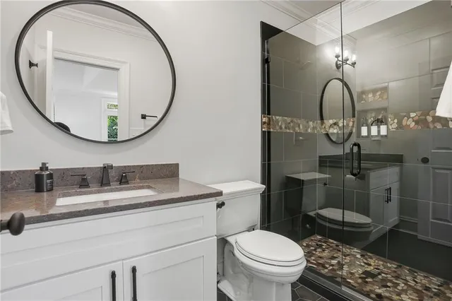 a view of a room with a ceiling fan and a large window