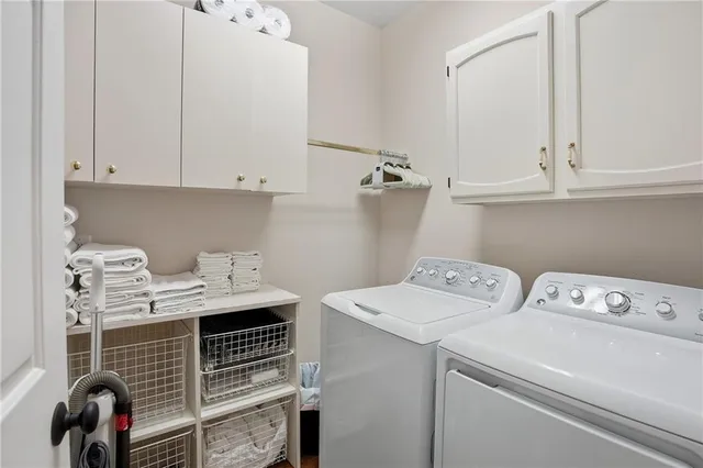 a bathroom with a granite countertop sink a mirror and shower