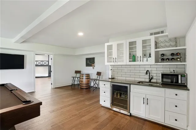 a view of balcony with wooden floor and fence