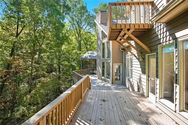 a picture of floor with a white wall and a painting