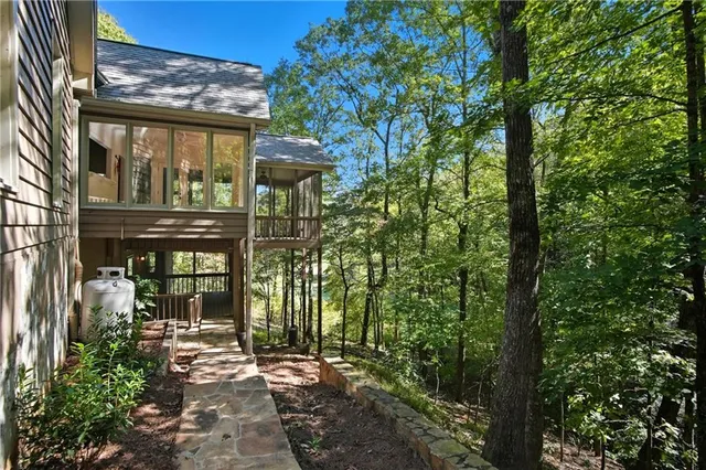 a view of a lake with houses in the back