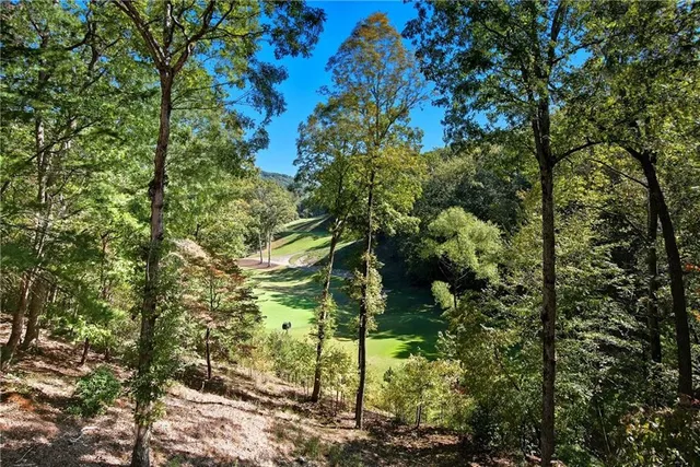 a view of a chairs and table in patio