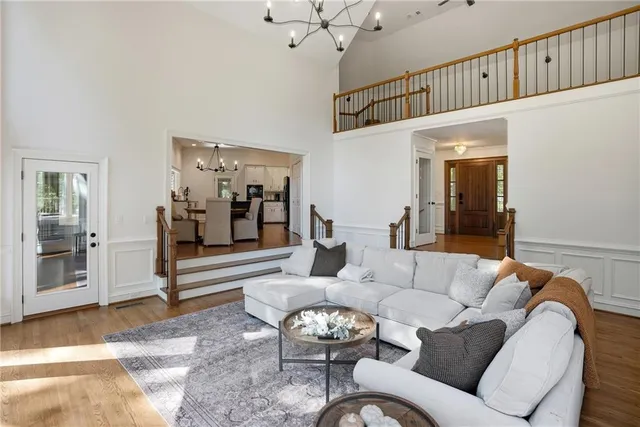 a kitchen with refrigerator cabinets dining table and chairs