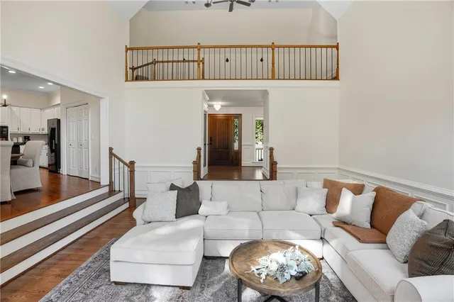 a kitchen with a stove a refrigerator and a dining table