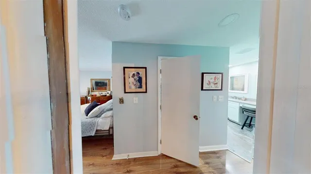 a view of a bedroom bathroom and front door