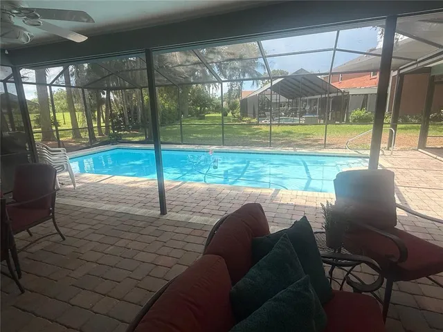 a view of swimming pool with a patio