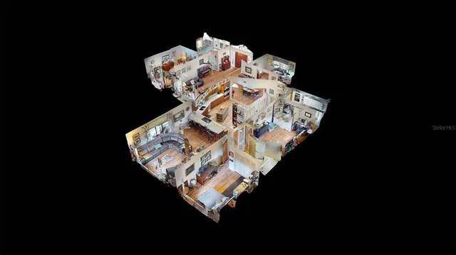 a bed sitting in a bedroom next to a lamp