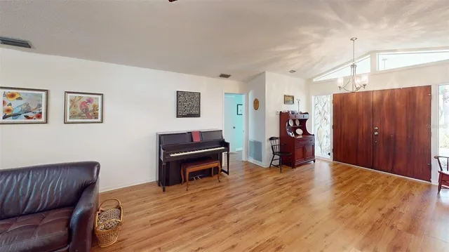 a view of a livingroom with furniture and wooden floor