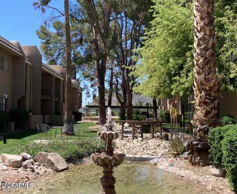 7436 East Chaparral Road, Unit B151 Scottsdale, AZ 85250 - Photo 1 of 19 a view of backyard of a house with outdoor seating