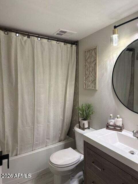 7436 East Chaparral Road, Unit B151 Scottsdale, AZ 85250 - Photo 11 of 19 a bathroom with a toilet a sink and a mirror