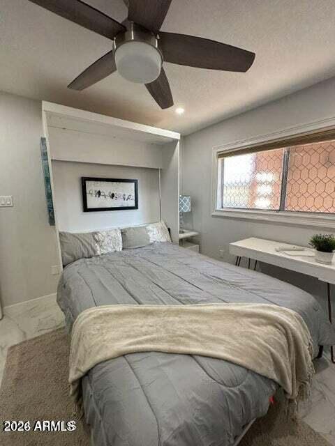 7436 East Chaparral Road, Unit B151 Scottsdale, AZ 85250 - Photo 13 of 19 a bedroom with a large bed and a large window