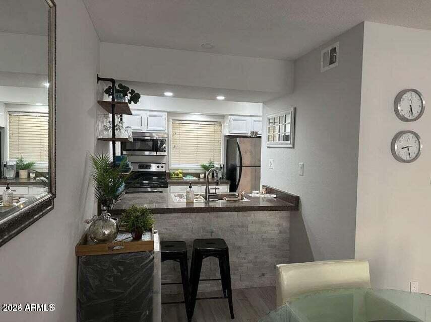 7436 East Chaparral Road, Unit B151 Scottsdale, AZ 85250 - Photo 5 of 19 a kitchen with a table and chairs in it