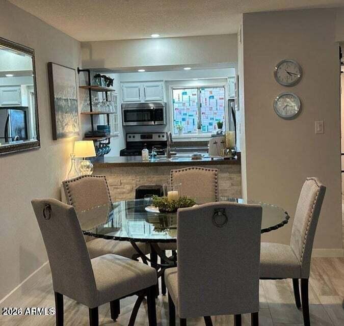 7436 East Chaparral Road, Unit B151 Scottsdale, AZ 85250 - Photo 6 of 19 a dining room with furniture and window