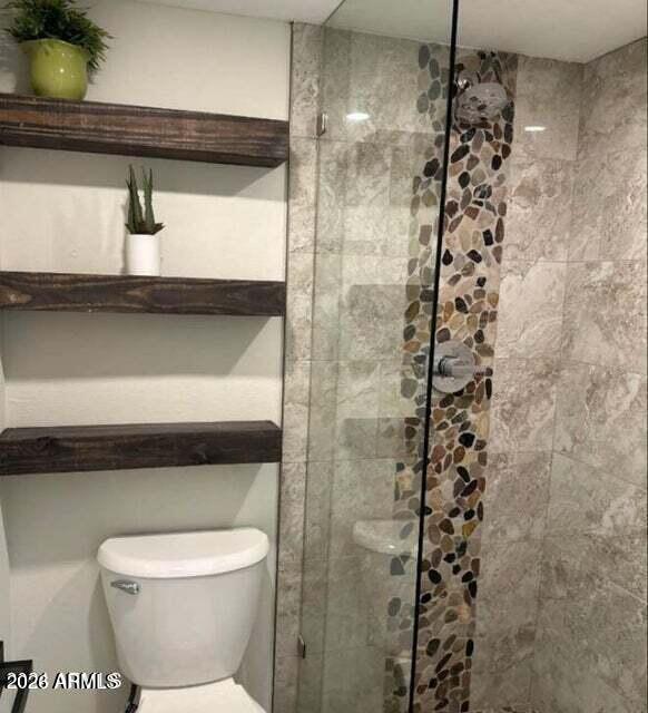 7436 East Chaparral Road, Unit B151 Scottsdale, AZ 85250 - Photo 8 of 19 a bathroom with a toilet and a shower