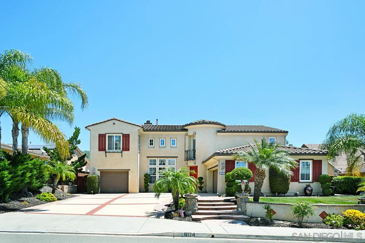 604 Hidden Trails Road Escondido, CA 92027 - Photo 1 of 49 a front view of a house with a garden