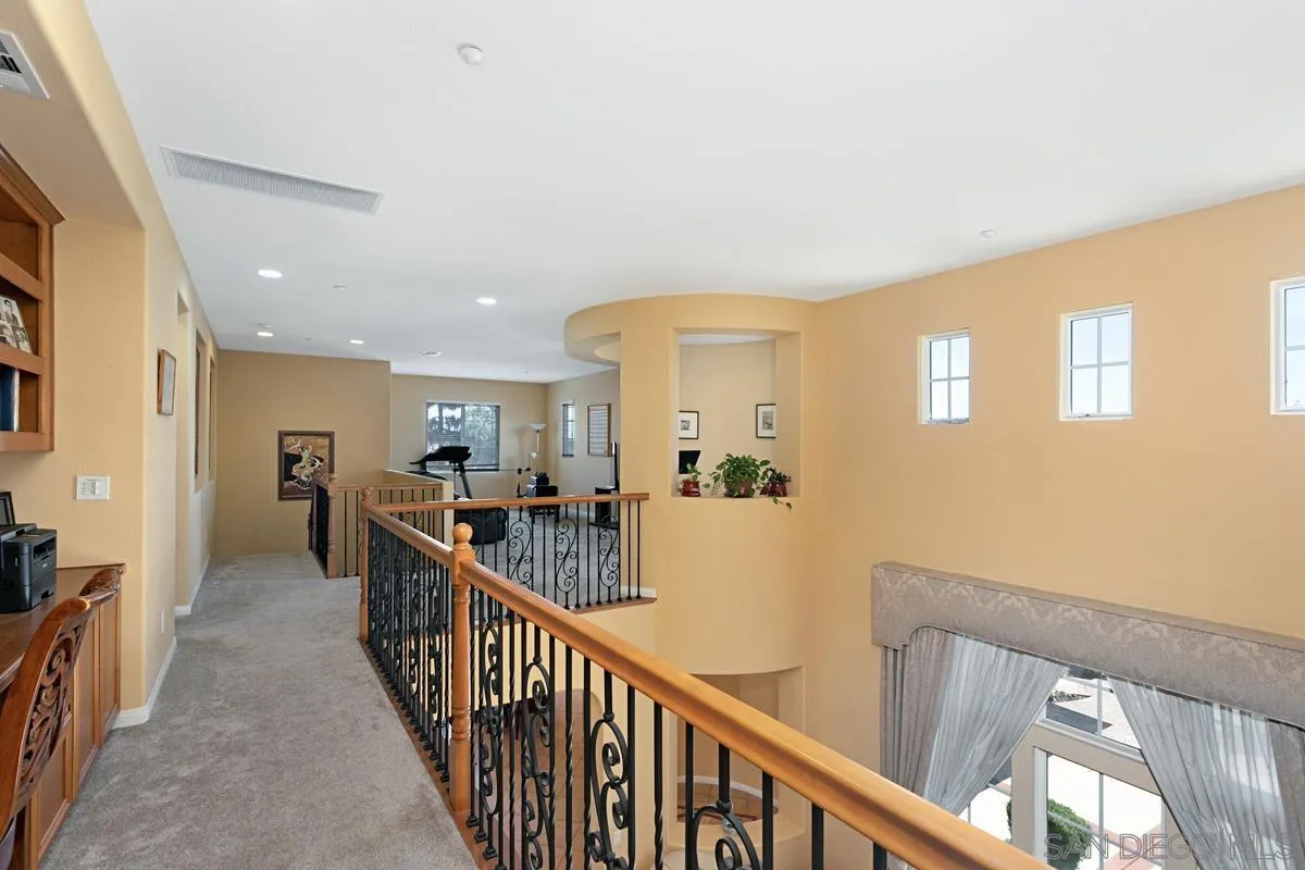 604 Hidden Trails Road Escondido, CA 92027 - Photo 23 of 49 a view of a hallway with workspace