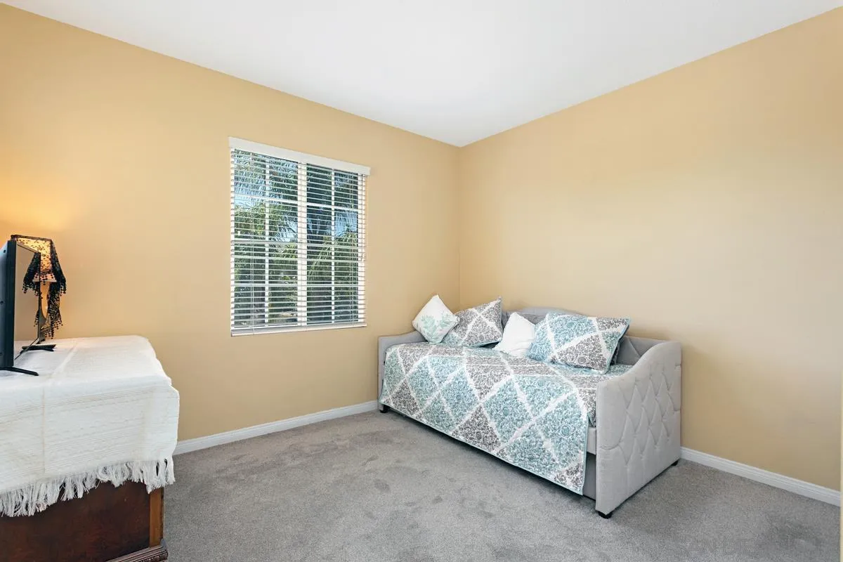 604 Hidden Trails Road Escondido, CA 92027 - Photo 24 of 49 a bedroom with bed and window