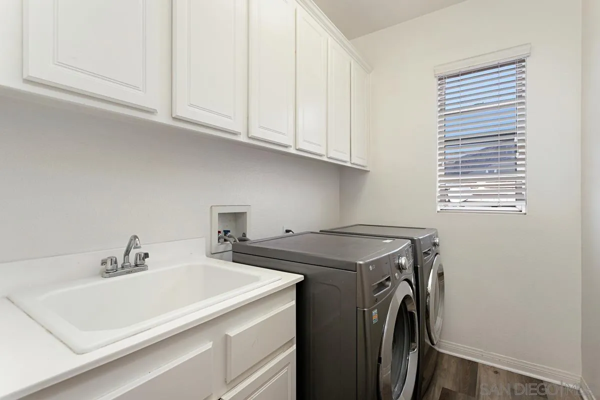 604 Hidden Trails Road Escondido, CA 92027 - Photo 25 of 49 a utility room with dryer and washer