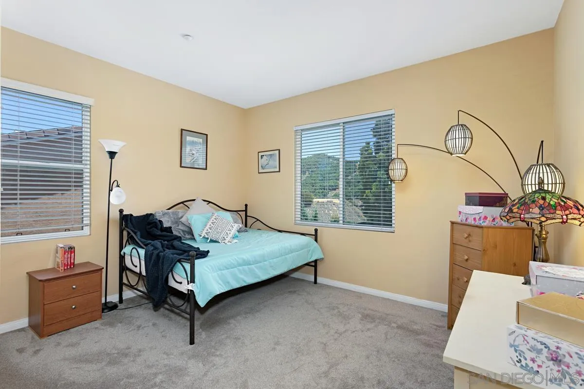 604 Hidden Trails Road Escondido, CA 92027 - Photo 27 of 49 a bedroom with a bed and a window