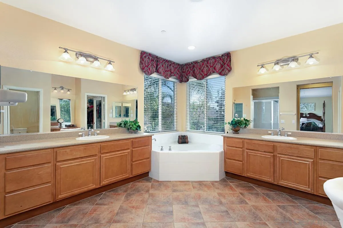 604 Hidden Trails Road Escondido, CA 92027 - Photo 35 of 49 a large bathroom with a large tub and sink
