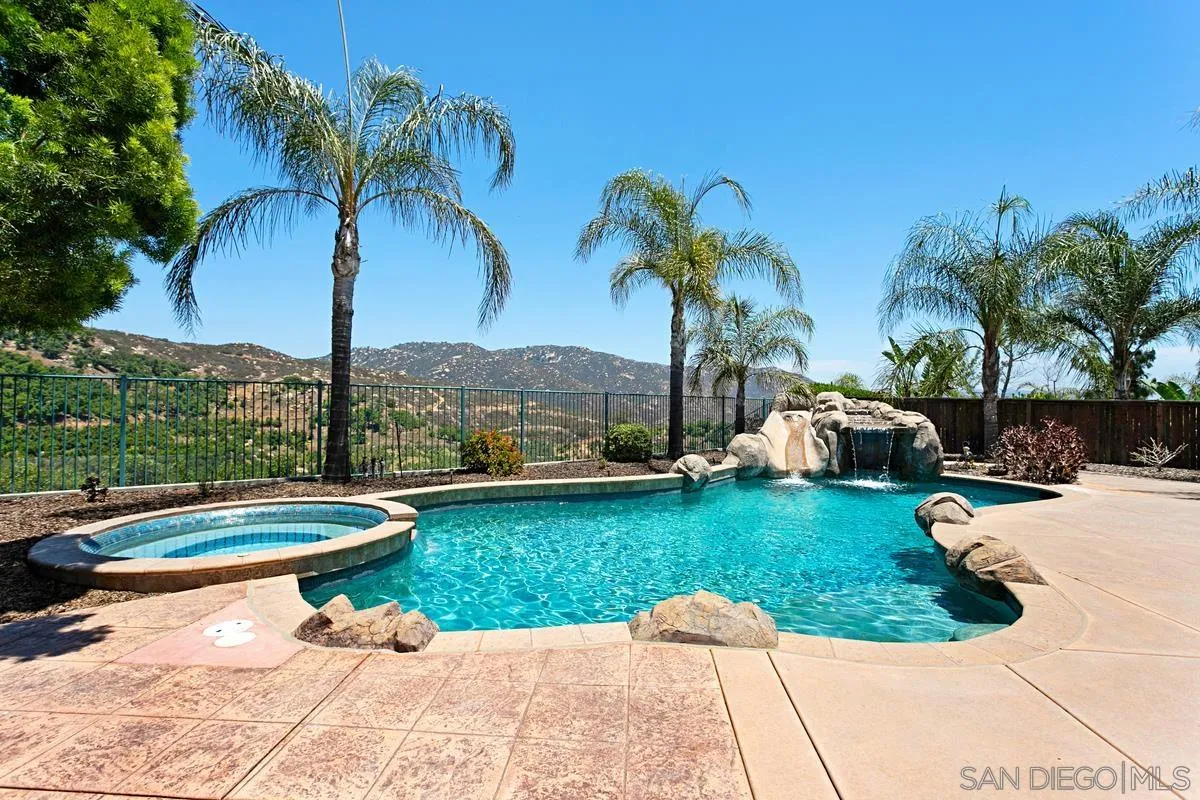 604 Hidden Trails Road Escondido, CA 92027 - Photo 44 of 49 a view of swimming pool with a table and chairs