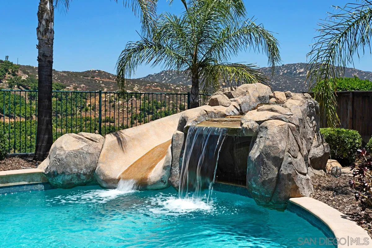 604 Hidden Trails Road Escondido, CA 92027 - Photo 46 of 49 a view of a garden with a slide