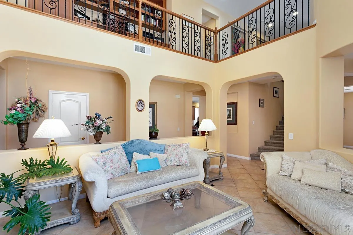 604 Hidden Trails Road Escondido, CA 92027 - Photo 7 of 49 a living room with furniture and a chandelier