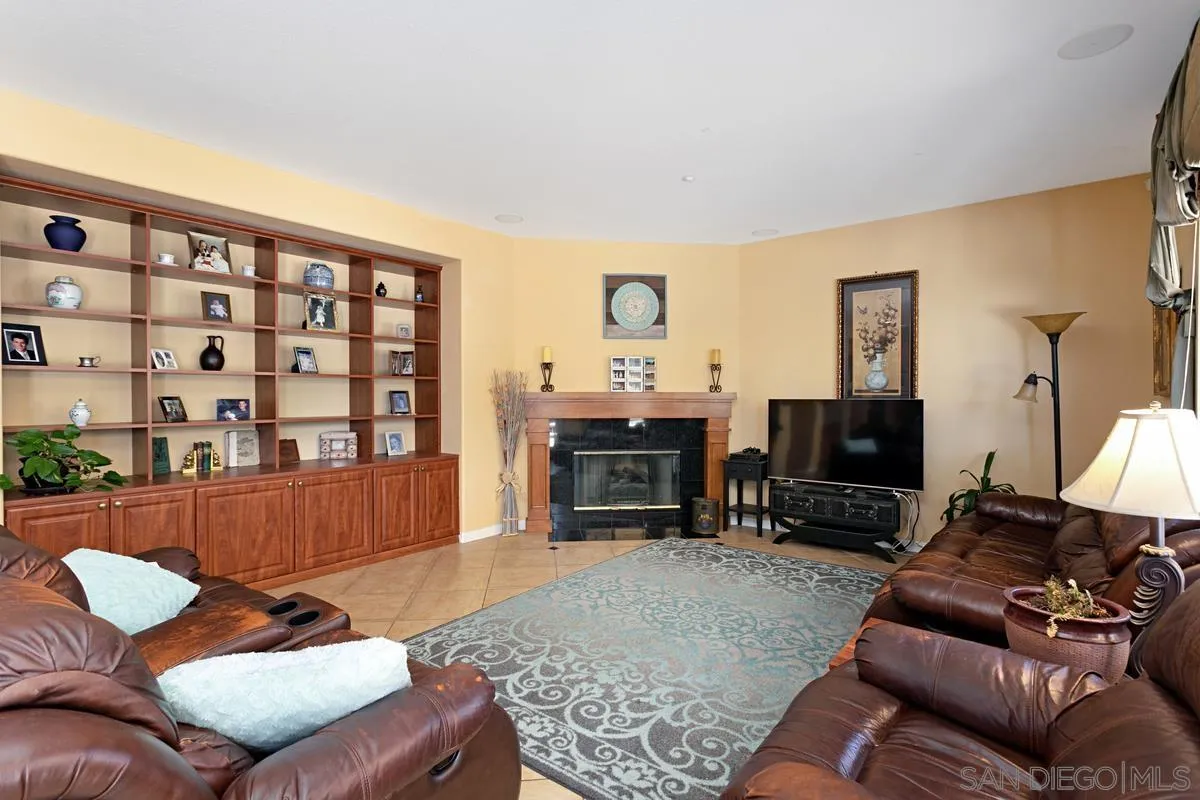 604 Hidden Trails Road Escondido, CA 92027 - Photo 9 of 49 a living room with furniture and a fireplace
