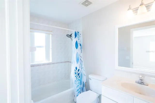 a bathroom with a sink toilet and bathtub