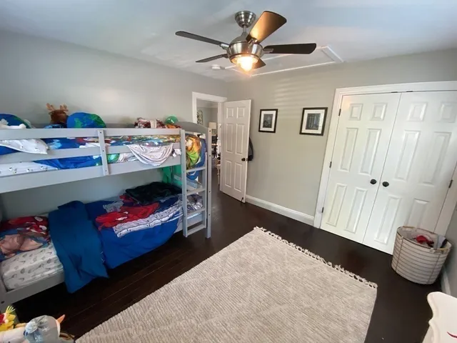 a bed room with a bed and a chandelier