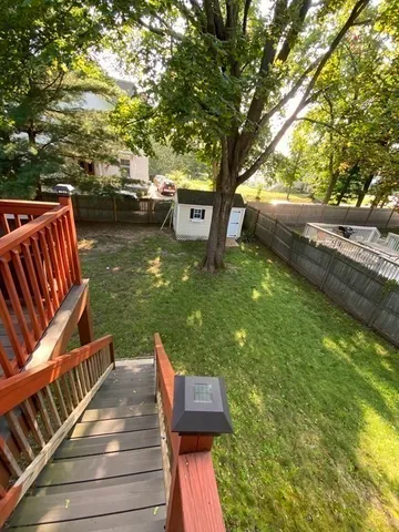 a backyard of a house with lots of green space