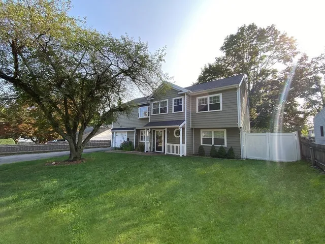 a view of a yard in front of a house