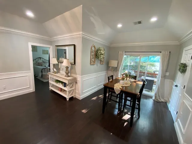 a view of a dining room with furniture window and outside view