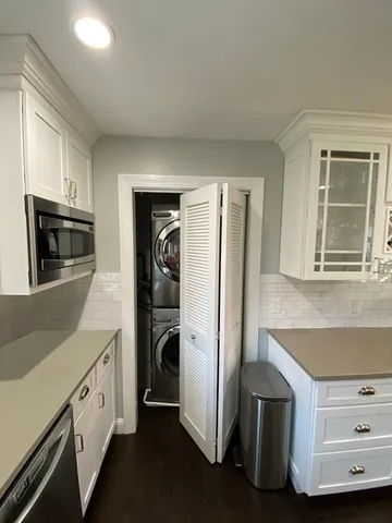 a kitchen with stainless steel appliances a refrigerator and a stove