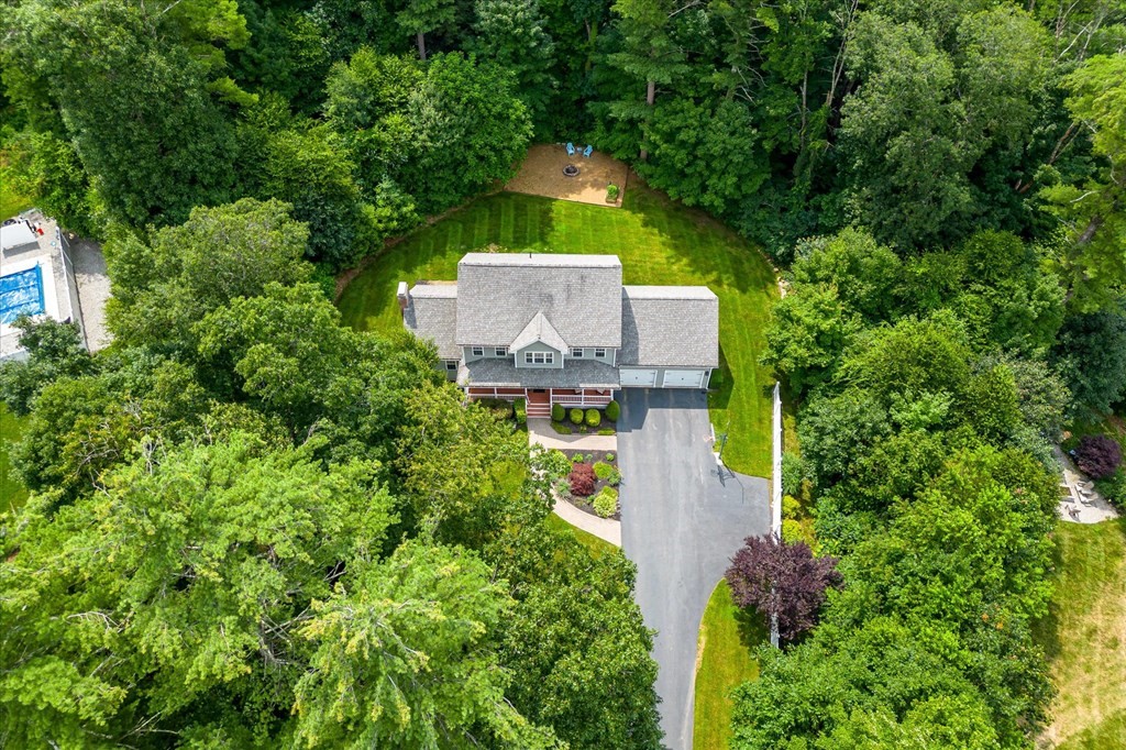 32 Draper Woods Road Sturbridge, MA 01518 - Photo 3 of 42 an aerial view of a house with a yard