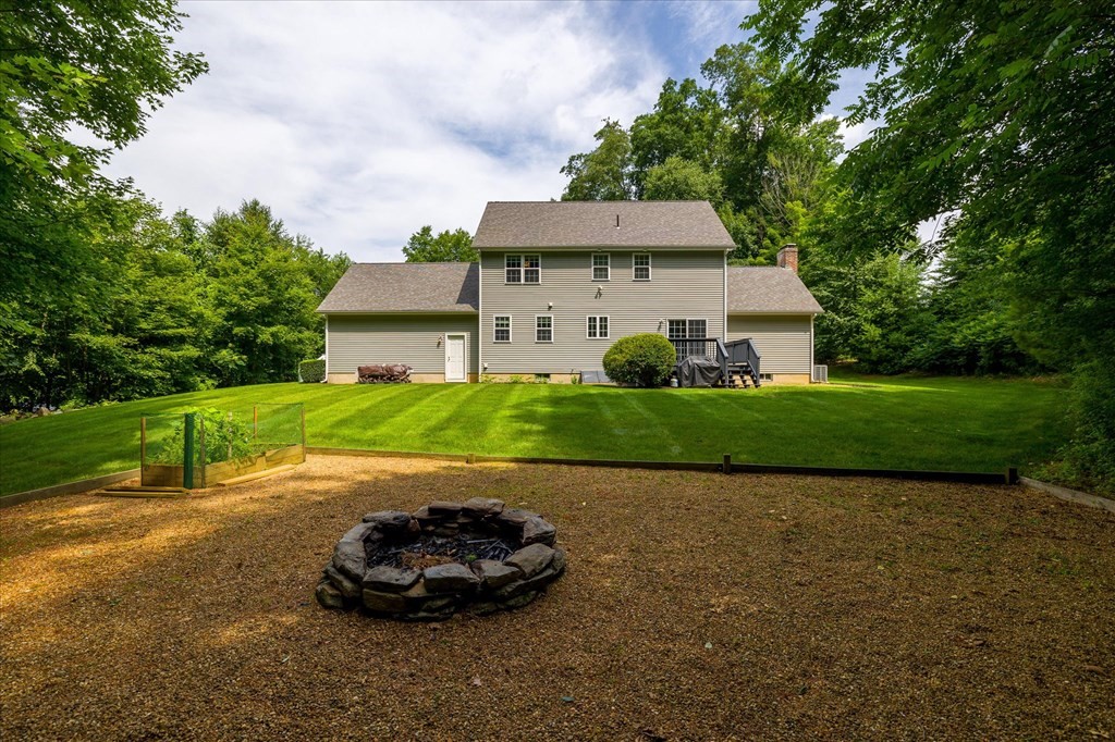 32 Draper Woods Road Sturbridge, MA 01518 - Photo 33 of 42 a view of a house with a yard