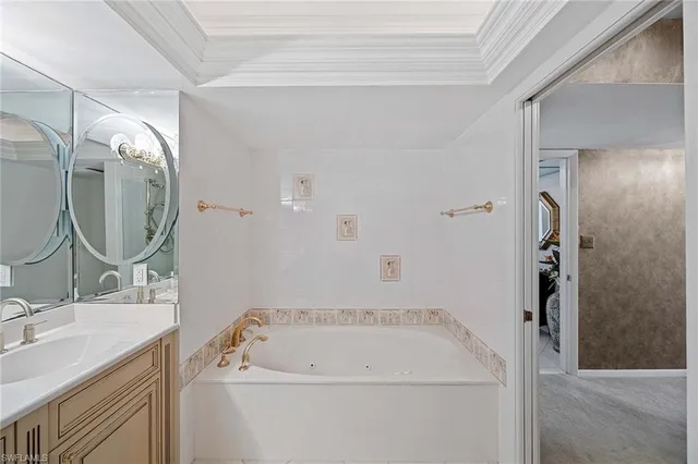 a bathroom with a sink a vanity and a mirror