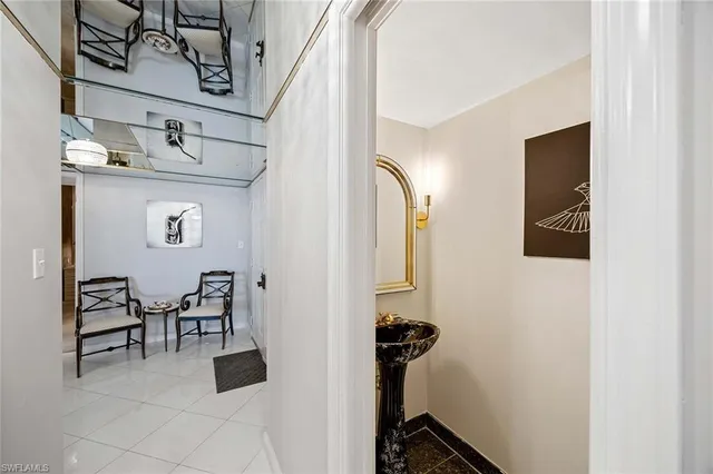 a view of a hallway with furniture and entryway