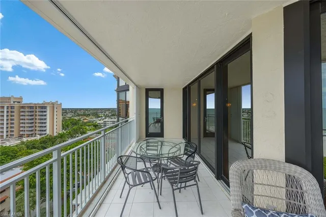 a view of balcony with furniture