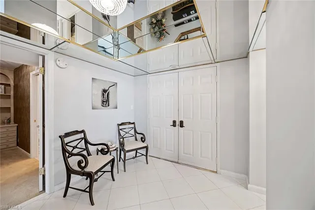 a view of a room with table and chairs