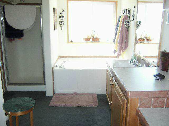820 Tear Road Grandview, WA 98930 - Photo 3 of 6 a bathroom with a sink and a mirror