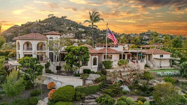 a living room with furniture a table and chairs