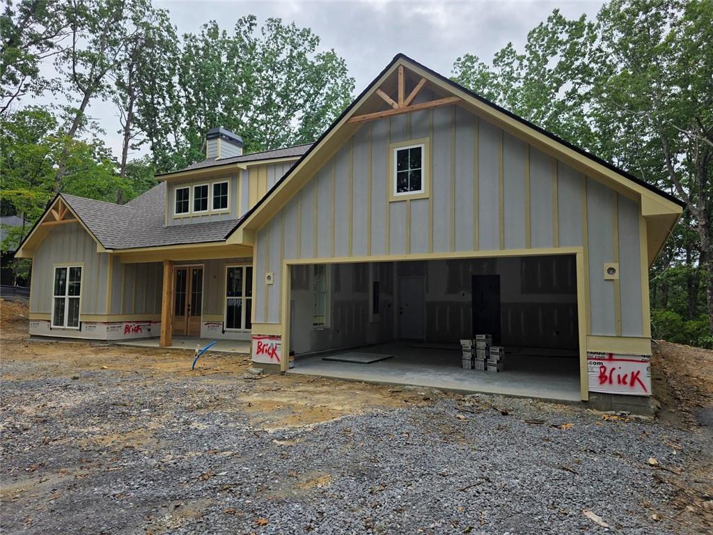 86 Turkey Trail Jasper, GA 30143 - Photo 1 of 13 a front view of a house with a yard and garage