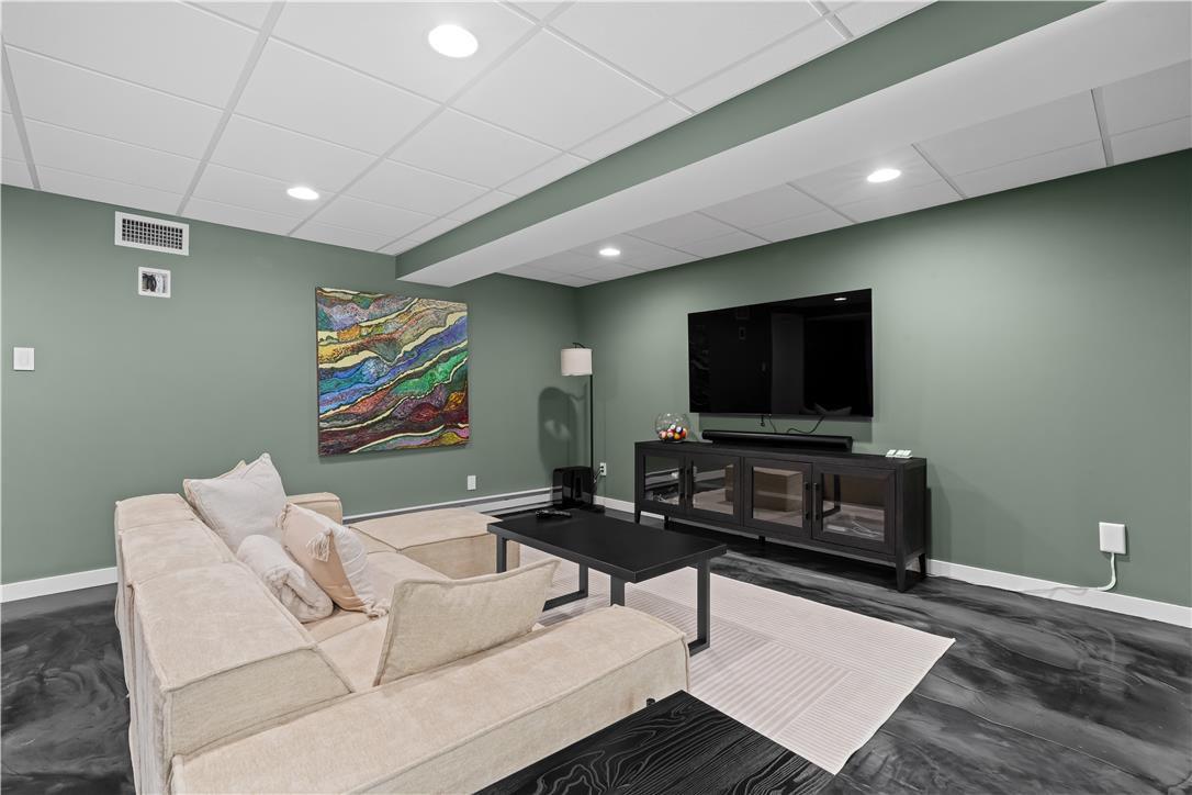 1506 Pleasant View Road Coopersburg, PA 18036 - Photo 67 of 97 Recessed lighting illuminates this well-appointed family room, creating a comfortable and inviting atmosphere for relaxation.