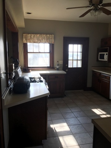 47 12n204 Il Route Hampshire, IL 60140 - Photo 17 of 25 a kitchen with a sink window and cabinets