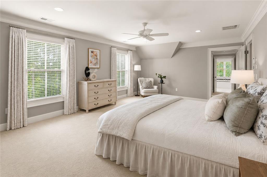 1450 Acworth Due West Road Northwest Kennesaw, GA 30152 - Photo 33 of 77 a bedroom with a large bed and ceiling fan