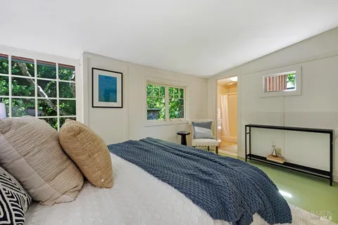 a bedroom with a bed and window